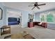 Bright bedroom featuring neutral-colored walls, carpet floors and large windows with natural light at 5154 Meadowbrook Cir, Suwanee, GA 30024