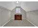 Spacious walk-in closet with ample shelving, a center dresser, and a natural light window at 5154 Meadowbrook Cir, Suwanee, GA 30024