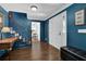 Elegant foyer with hardwood floors, stairway, and stylish blue walls at 5154 Meadowbrook Cir, Suwanee, GA 30024