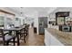 Spacious kitchen adjacent to dining area with stainless steel refrigerator at 5154 Meadowbrook Cir, Suwanee, GA 30024