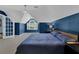Primary bedroom featuring an expansive layout, natural lighting, and a large arched window at 5154 Meadowbrook Cir, Suwanee, GA 30024