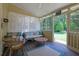 Screened-in porch with comfortable seating and scenic outdoor views at 5154 Meadowbrook Cir, Suwanee, GA 30024