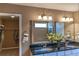 Bathroom with double sinks, granite countertop, mirror, and walk-in closet in the background at 5268 Mulberry Pass Ct, Hoschton, GA 30548