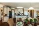 Bright dining area featuring open concept kitchen and neutral paint tones at 5268 Mulberry Pass Ct, Hoschton, GA 30548