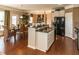Kitchen area featuring dark wood floors, granite countertops, and stainless steel appliances at 5268 Mulberry Pass Ct, Hoschton, GA 30548