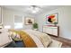Bedroom featuring bright lighting, a plant, wall art, and natural light from the window at 1150 Collier Nw Rd # G8, Atlanta, GA 30318