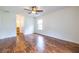 Empty bedroom featuring laminate flooring, a ceiling fan, and natural light from the window at 1150 Collier Nw Rd # G8, Atlanta, GA 30318