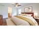 Bedroom showcasing a ceiling fan, wood laminate flooring, and natural light from the window at 1150 Collier Nw Rd # G8, Atlanta, GA 30318