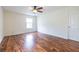 Unfurnished bedroom featuring laminate flooring, a window, and a ceiling fan at 1150 Collier Nw Rd # G8, Atlanta, GA 30318