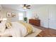 Bedroom with a ceiling fan, a window, laminate floors, and a plant at 1150 Collier Nw Rd # G8, Atlanta, GA 30318
