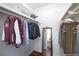 Organized walk-in closet with shelving and hanging storage, including a mirror at 1150 Collier Nw Rd # G8, Atlanta, GA 30318