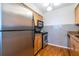 Featuring stainless steel refrigerator and oven, the kitchen cabinets offer ample storage space at 1150 Collier Nw Rd # G8, Atlanta, GA 30318