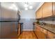 Updated kitchen boasts stainless steel appliances, subway tile, and granite countertops at 1150 Collier Nw Rd # G8, Atlanta, GA 30318