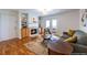 Inviting living room featuring a fireplace, hardwood floors, and access to a balcony at 1150 Collier Nw Rd # G8, Atlanta, GA 30318