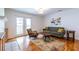 Bright living room with hardwood floors and access to a balcony at 1150 Collier Nw Rd # G8, Atlanta, GA 30318