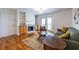 Inviting living room featuring a fireplace, hardwood floors, and access to a balcony at 1150 Collier Nw Rd # G8, Atlanta, GA 30318