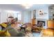 Bright living room with fireplace, hardwood floors, and dining area at 1150 Collier Nw Rd # G8, Atlanta, GA 30318