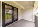 Bare outdoor patio showing outdoor space and access to interior unit through glass doors at 1150 Collier Nw Rd # G8, Atlanta, GA 30318