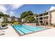 Community pool with lounge chairs and manicured landscaping at 1150 Collier Nw Rd # G8, Atlanta, GA 30318