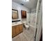 Bathroom featuring a vanity with storage, a toilet, and a shower-tub combination with tile surround at 3705 Orchard Dr, Atlanta, GA 30349