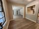 Inviting living room showcasing wood-look flooring, neutral decor, and seamless flow to the adjacent kitchen area at 3705 Orchard Dr, Atlanta, GA 30349