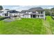 Stunning white home with a sprawling green lawn, gazebo, and elegant water feature at 3735 Hamilton Mill Rd, Buford, GA 30519