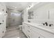 Bright bathroom with a glass shower, double vanity, and modern fixtures at 3735 Hamilton Mill Rd, Buford, GA 30519