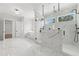 Stunning bathroom with white marble tile, walk-in shower, and luxurious soaking tub at 3735 Hamilton Mill Rd, Buford, GA 30519
