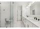Well-lit bathroom featuring double sinks, marble counters, a glass shower, and a toilet at 3735 Hamilton Mill Rd, Buford, GA 30519