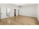 Large bedroom featuring hardwood floors, and a stylish light fixture at 3735 Hamilton Mill Rd, Buford, GA 30519