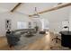 Virtually staged bonus room with hardwood floors, wooden beams, and stylish decor at 3735 Hamilton Mill Rd, Buford, GA 30519