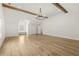 Spacious bonus room with hardwood floors, window seat, and modern lighting at 3735 Hamilton Mill Rd, Buford, GA 30519