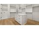 Large walk-in closet with center island, drawers, and built-in shelving at 3735 Hamilton Mill Rd, Buford, GA 30519