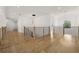 Spacious upstairs hallway with modern railing and hardwood floors at 3735 Hamilton Mill Rd, Buford, GA 30519