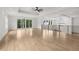 Open hallway with hardwood floors, sliding glass doors, and stylish lighting at 3735 Hamilton Mill Rd, Buford, GA 30519