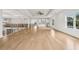 Spacious living area featuring a wet bar, hardwood floors, and modern finishes, perfect for entertaining guests at 3735 Hamilton Mill Rd, Buford, GA 30519