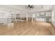 Open loft area with custom cabinetry, hardwood floors, and modern light fixtures, perfect for entertaining at 3735 Hamilton Mill Rd, Buford, GA 30519