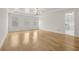 Spacious bedroom features tray ceilings, recessed lighting, and hardwood floors, with access to the ensuite at 3735 Hamilton Mill Rd, Buford, GA 30519