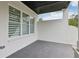 Covered patio with white brick and dark ceiling with a great view of backyard at 3735 Hamilton Mill Rd, Buford, GA 30519