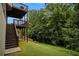 A tiered deck provides access to a lush, green backyard with privacy and natural beauty at 5925 Crescent Landing Dr, Cumming, GA 30028