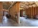 Unfinished basement with wooden frame, windows and a concrete floor at 5925 Crescent Landing Dr, Cumming, GA 30028
