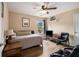 Cozy bedroom with a twin bed, ceiling fan, and warm, neutral-toned walls, perfect for relaxation at 5925 Crescent Landing Dr, Cumming, GA 30028