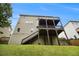 Exterior view of a multi-level deck overlooking a green backyard, perfect for outdoor entertaining and relaxation at 5925 Crescent Landing Dr, Cumming, GA 30028