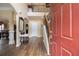 Bright foyer features hardwood floors, staircase, and entry to the dining room at 5925 Crescent Landing Dr, Cumming, GA 30028