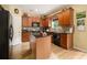Charming kitchen with wooden cabinets, granite countertops, and a functional center island at 5925 Crescent Landing Dr, Cumming, GA 30028