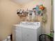 Functional laundry room equipped with a washer and dryer for convenient chores at 5925 Crescent Landing Dr, Cumming, GA 30028