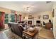 Spacious living room boasts a fireplace, plush seating, and ample natural light at 5925 Crescent Landing Dr, Cumming, GA 30028