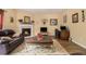 Inviting living room featuring a fireplace, comfortable seating, and natural light at 5925 Crescent Landing Dr, Cumming, GA 30028
