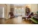 Cozy living room with bay windows, hardwood floors, and elegant furnishings at 5925 Crescent Landing Dr, Cumming, GA 30028