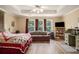 Bright bedroom featuring large windows, a ceiling fan, and ample space for relaxing and unwinding at 5925 Crescent Landing Dr, Cumming, GA 30028